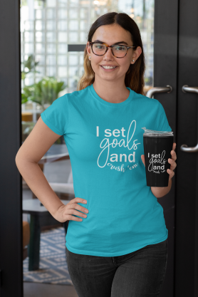 t-shirt-mockup-of-a-woman-holding-a-travel-mug-outside-a-restaurant-29314