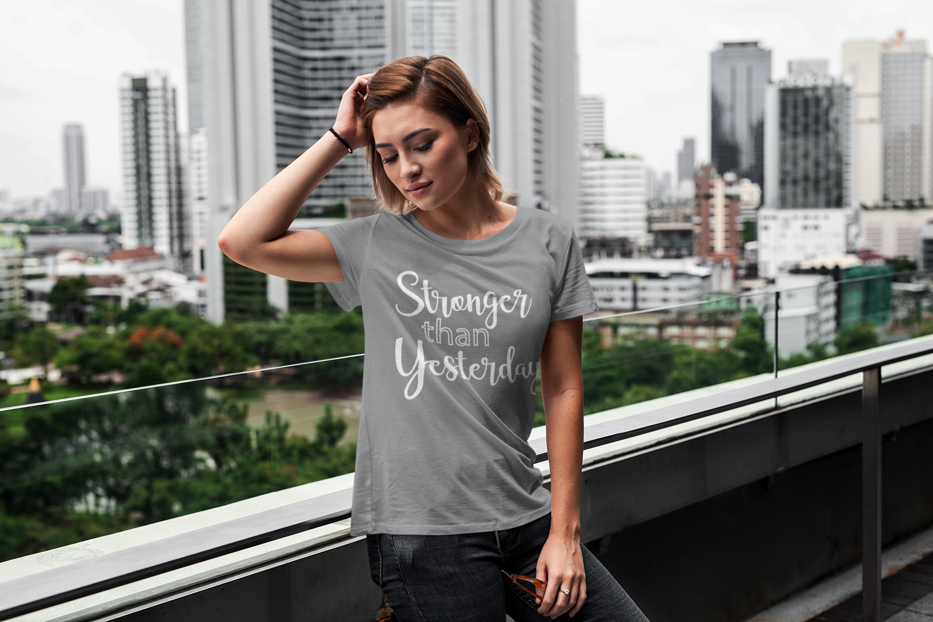 t-shirt-mockup-featuring-a-short-haired-woman-posing-on-a-balcony-416-el